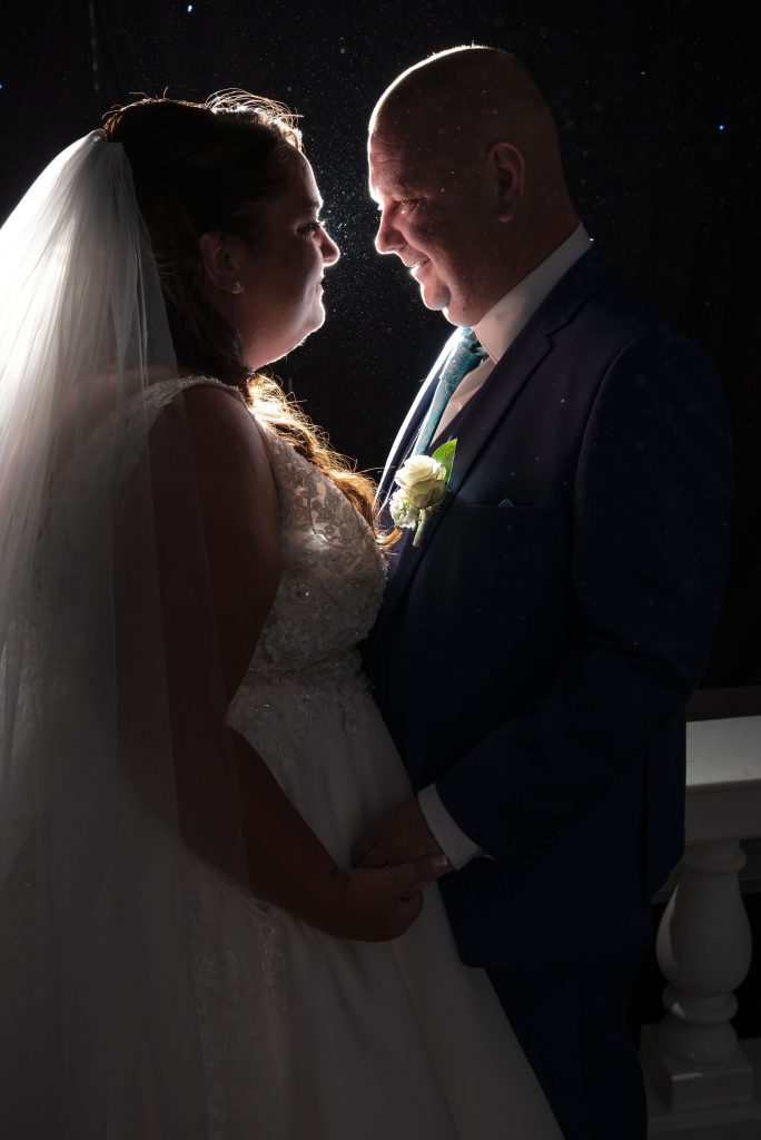 silhouette photograph with a soft glow of a newly married couple during their Liverpool wedding by Michael Pardoe | Cheshire wedding photographer